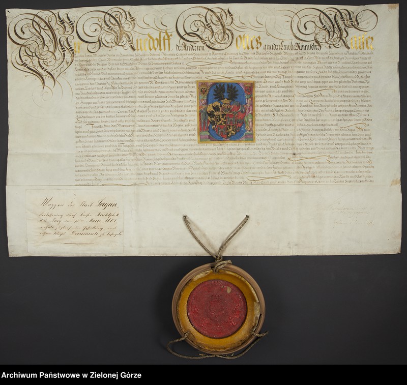 image.from.unit.number "Rudolf II cesarz ustanawia nowy herb dla miasta Żagania, określa jego barwy, nadaje również nową pieczęć i zezwala na używanie przez władze czerwonego wosku."